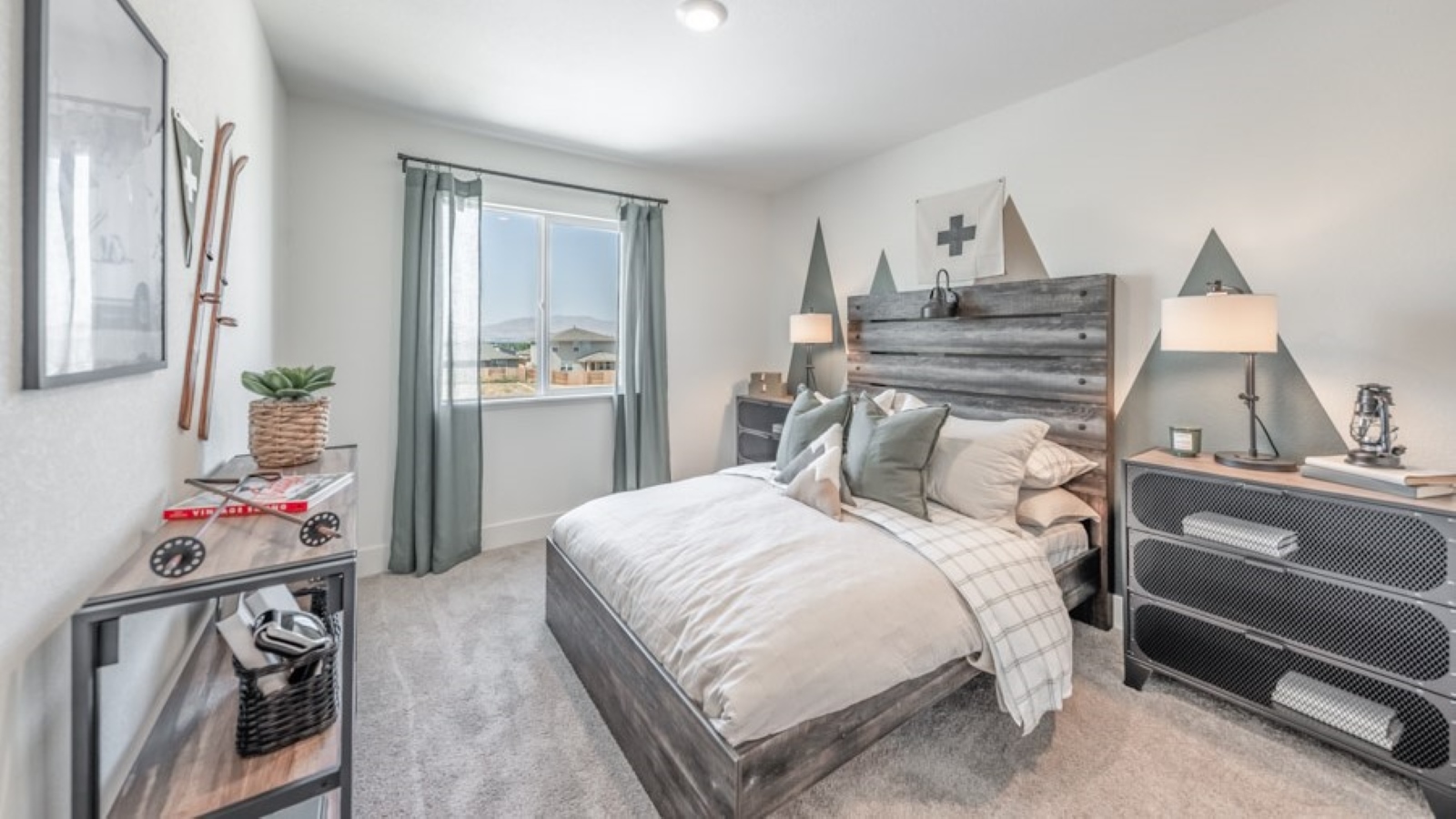 Bedroom decorated for a teen with a large window and carpeted floor