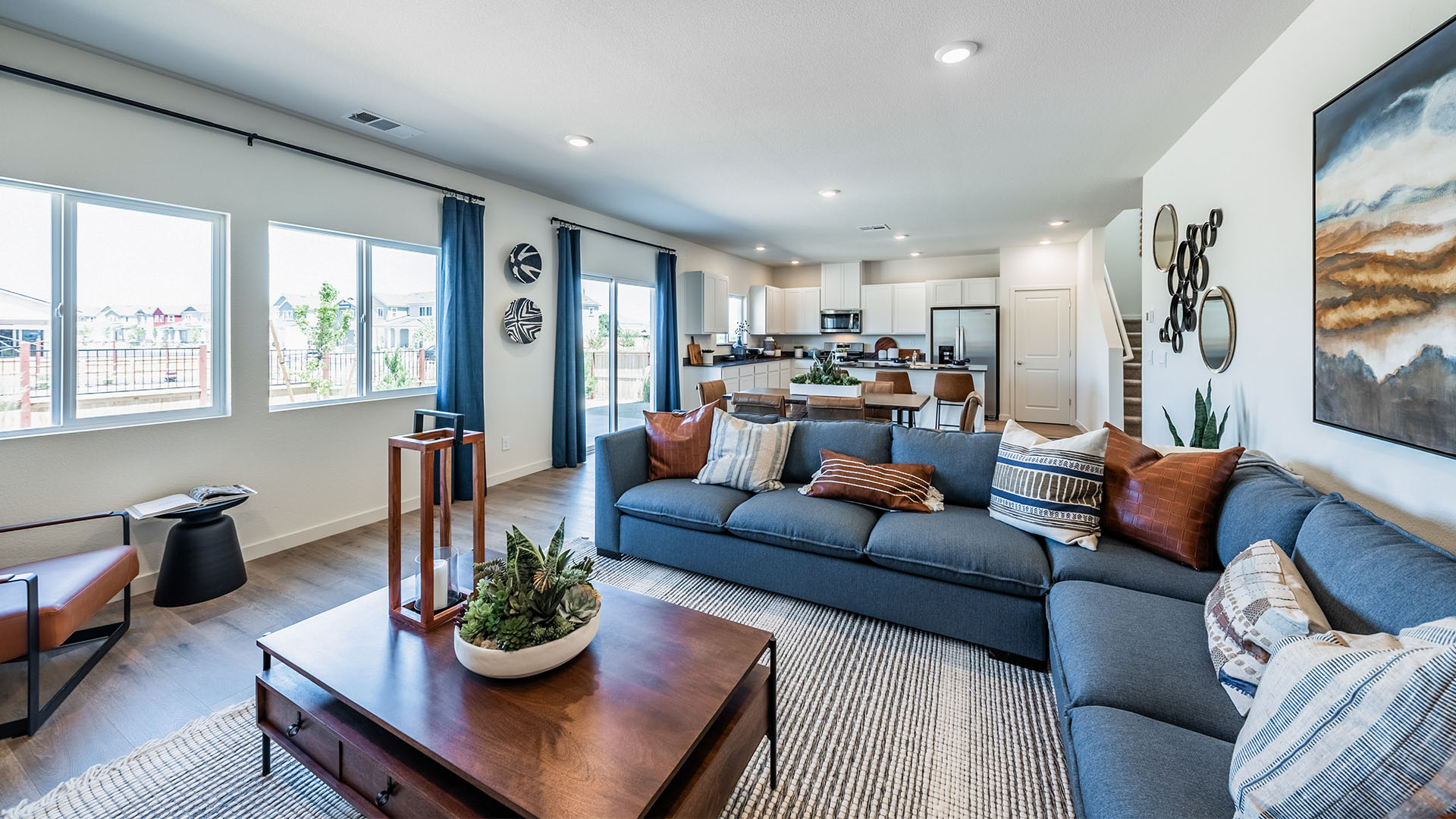 Modern living room with windows looking out into back yard