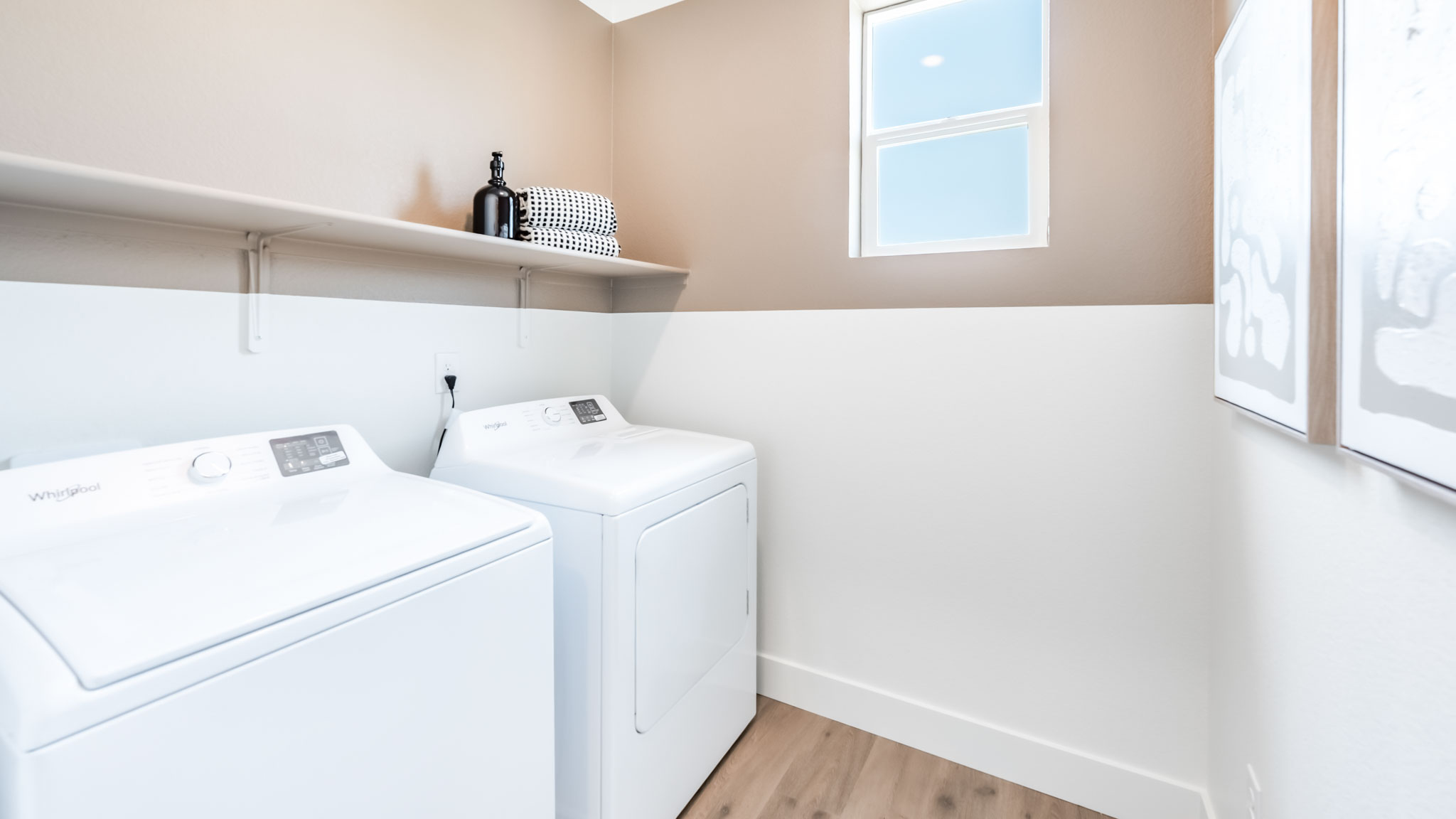 Laundry room with shelving and a window to let light in