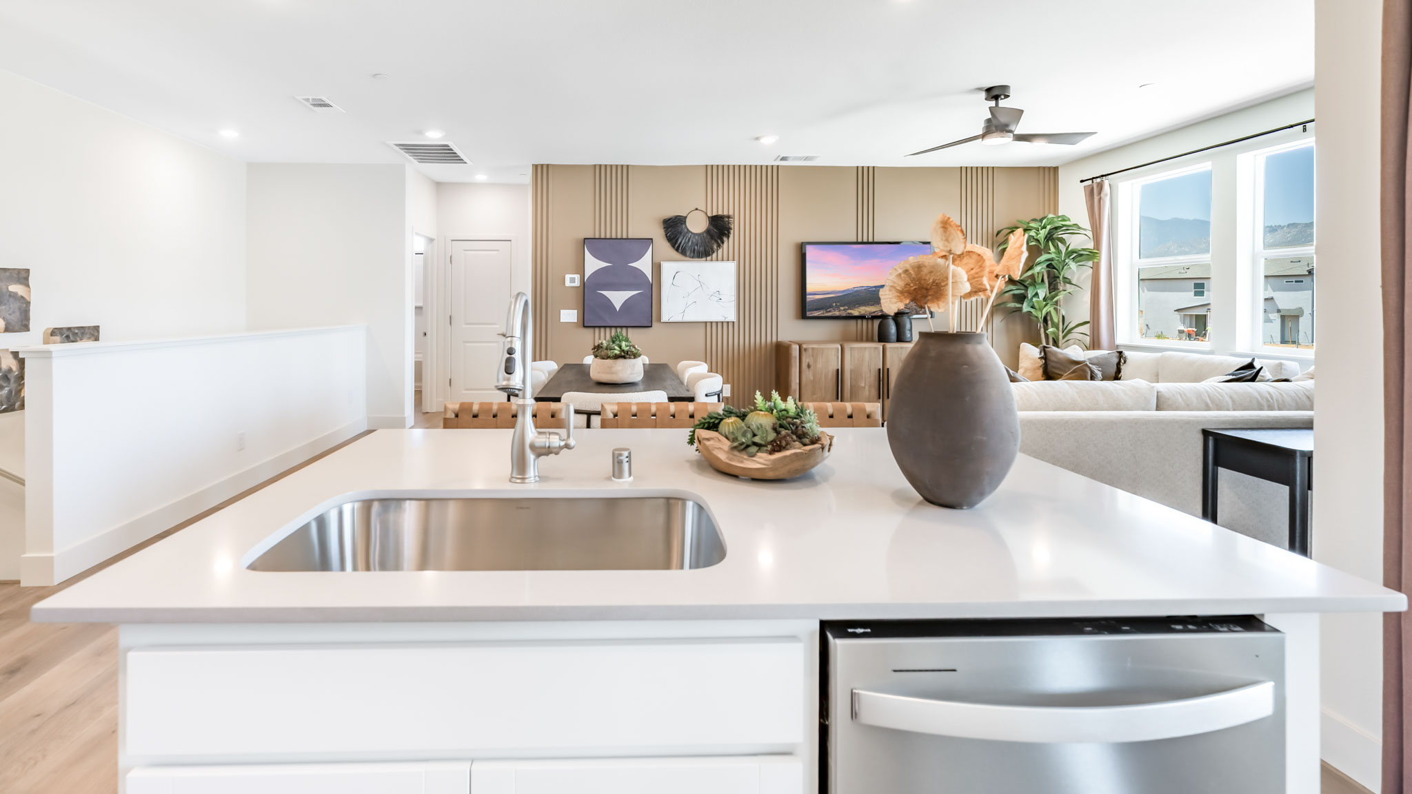 Kitchen island with a single basin sink and dishwasher