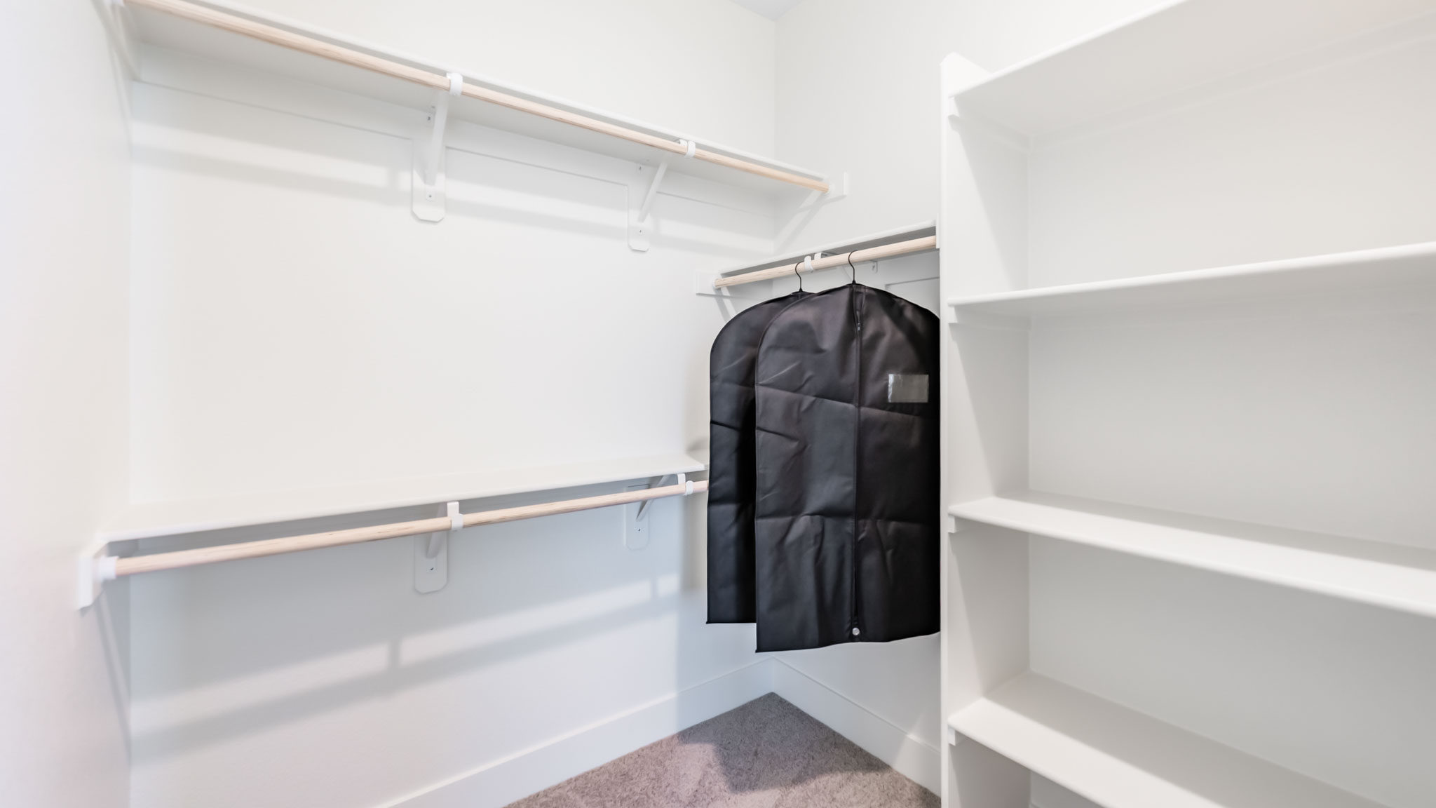 Large walk-in closet with shelving