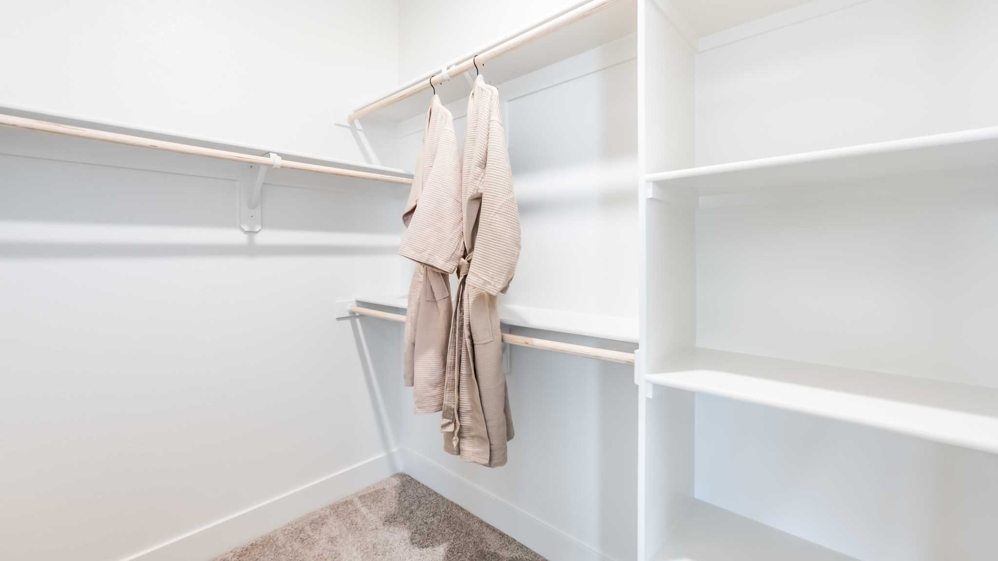Large walk in closet with shelving