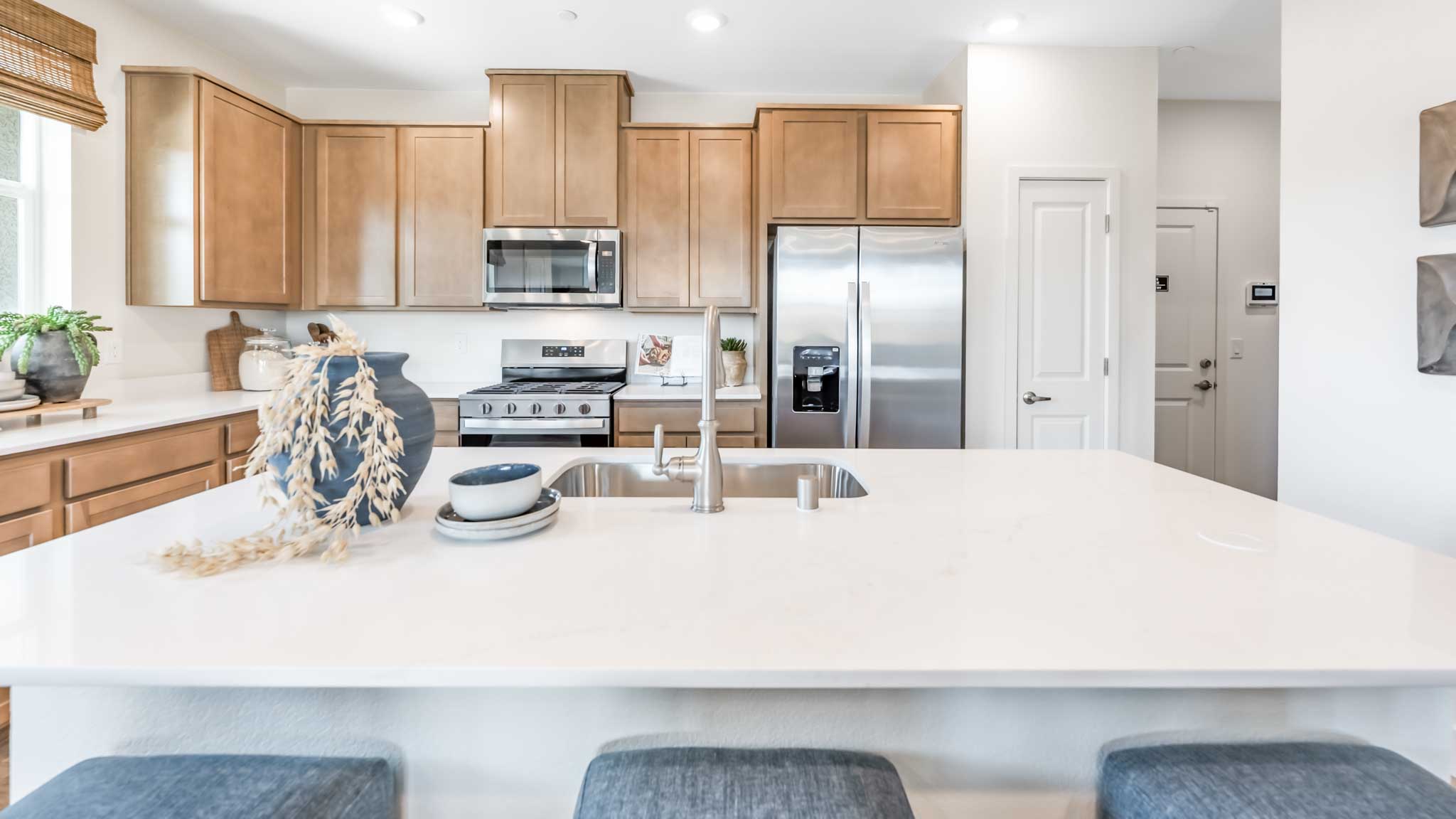 Kitchen island looking towards the stainless steel appliances