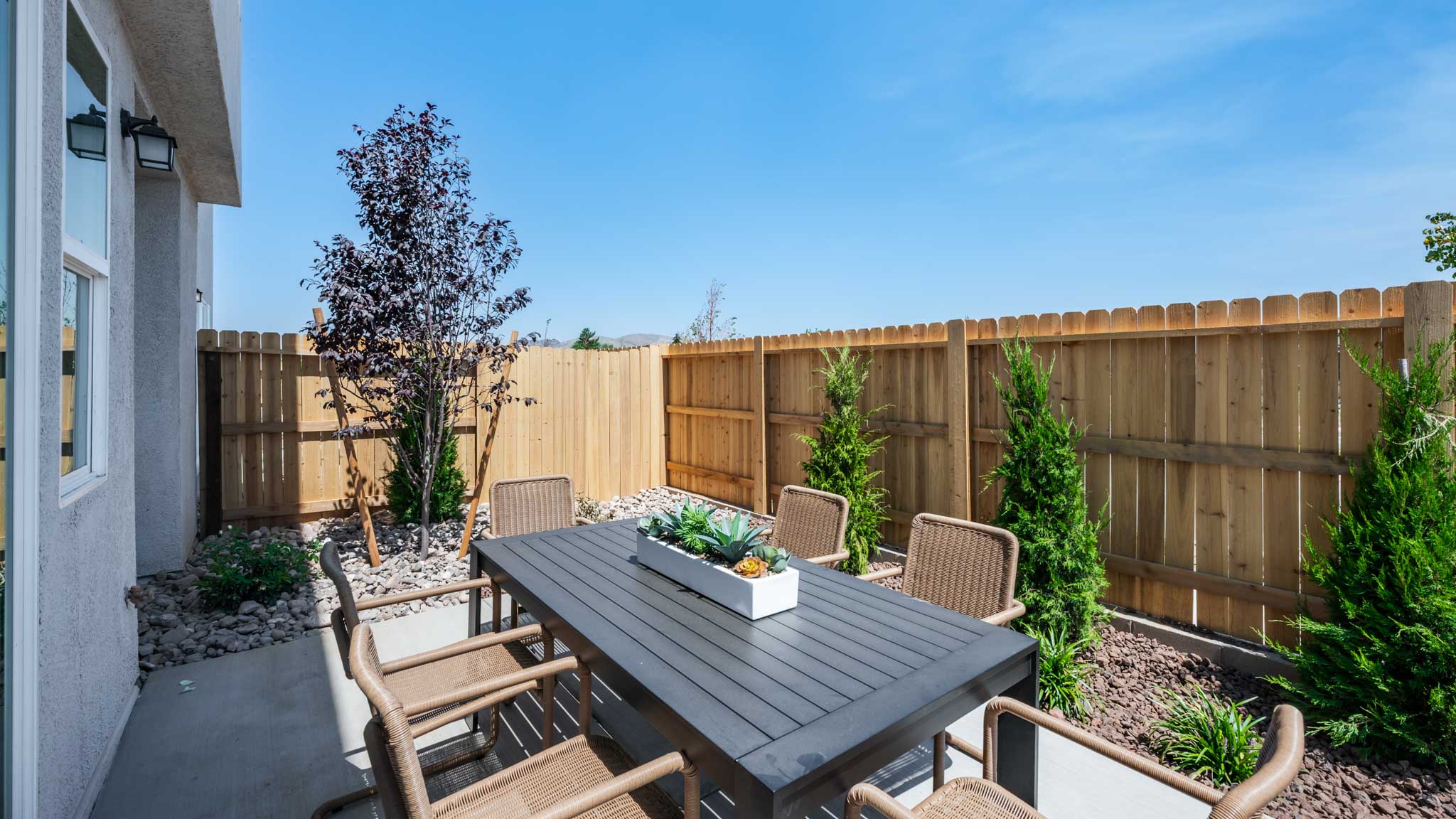 Backyard patio with outdoor dining table set