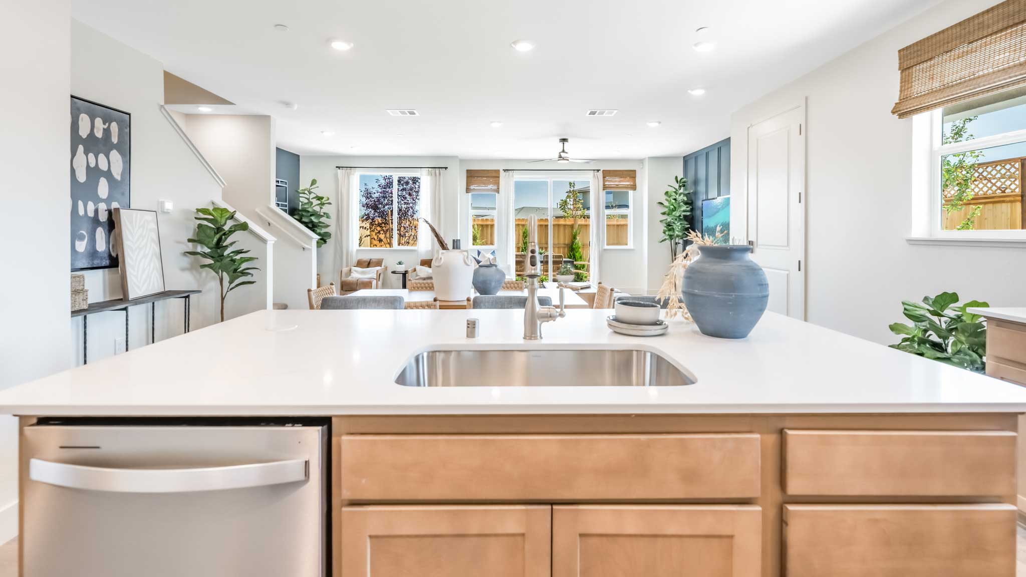 Kitchen island with a single basin sink and dishwasher