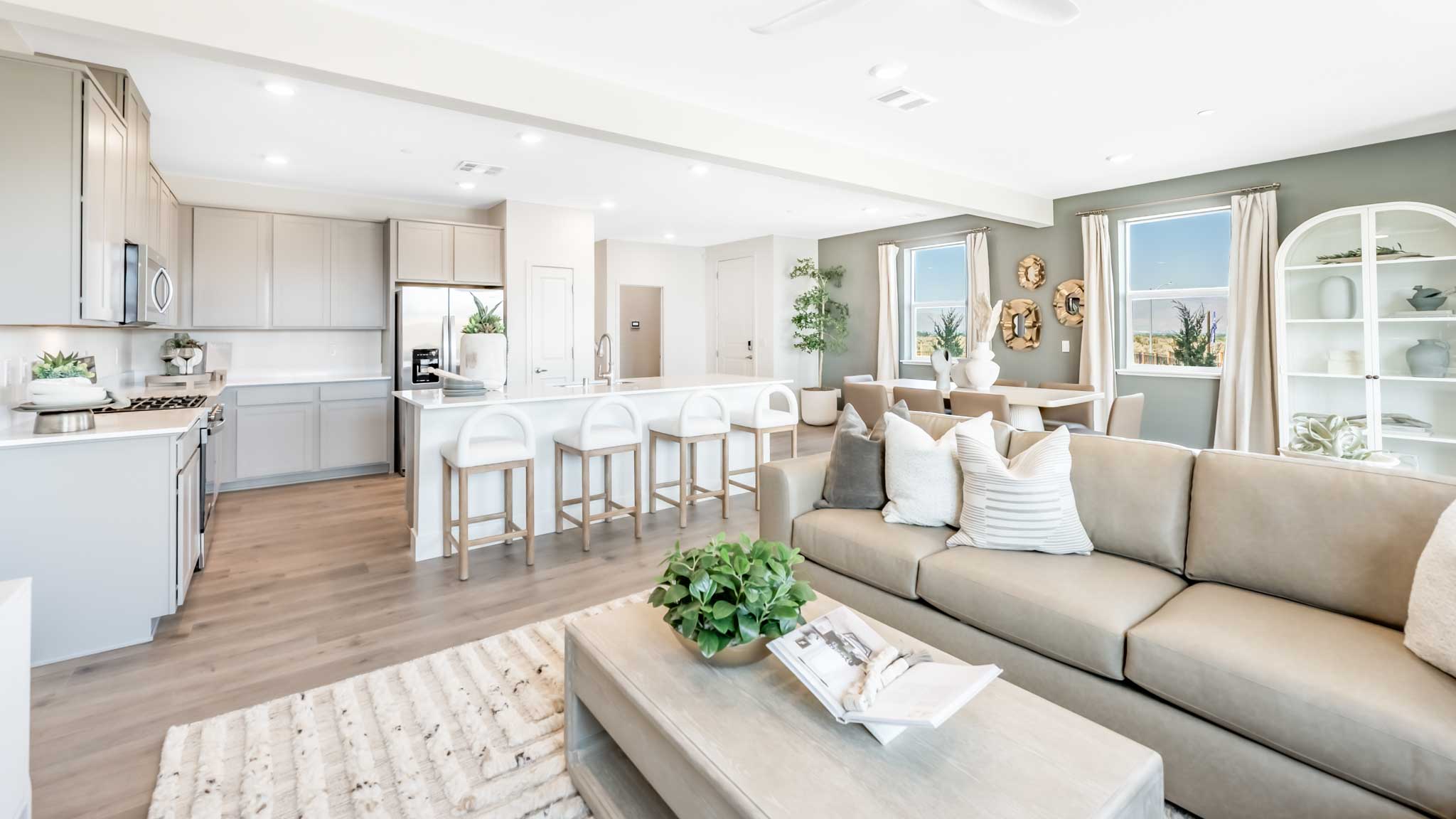 Bright open concept great room with a large sectional