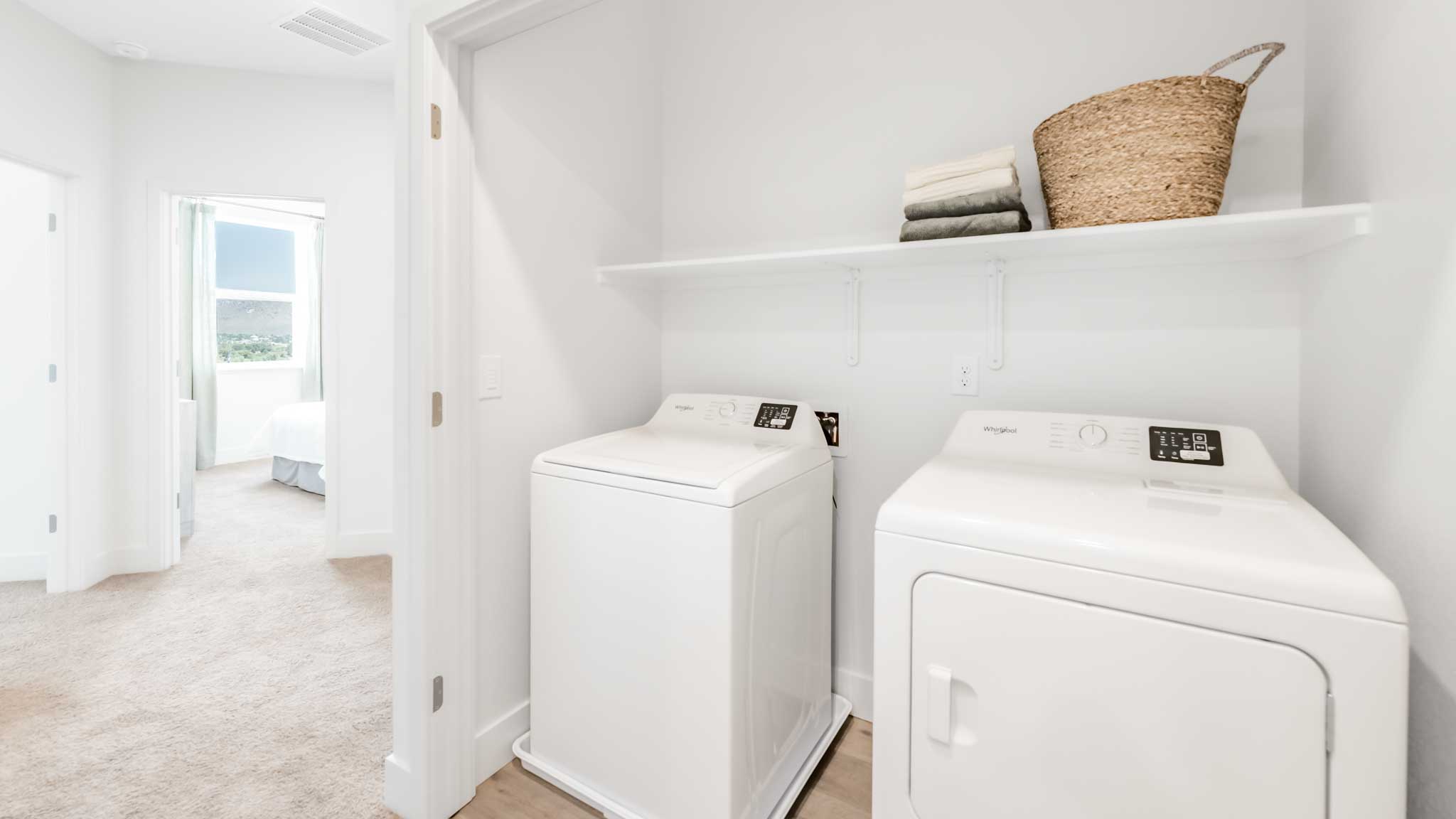 Laundry room with shelving