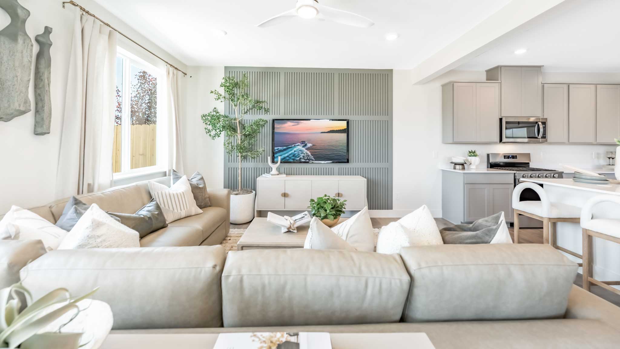 Open concept great room with accent wall
