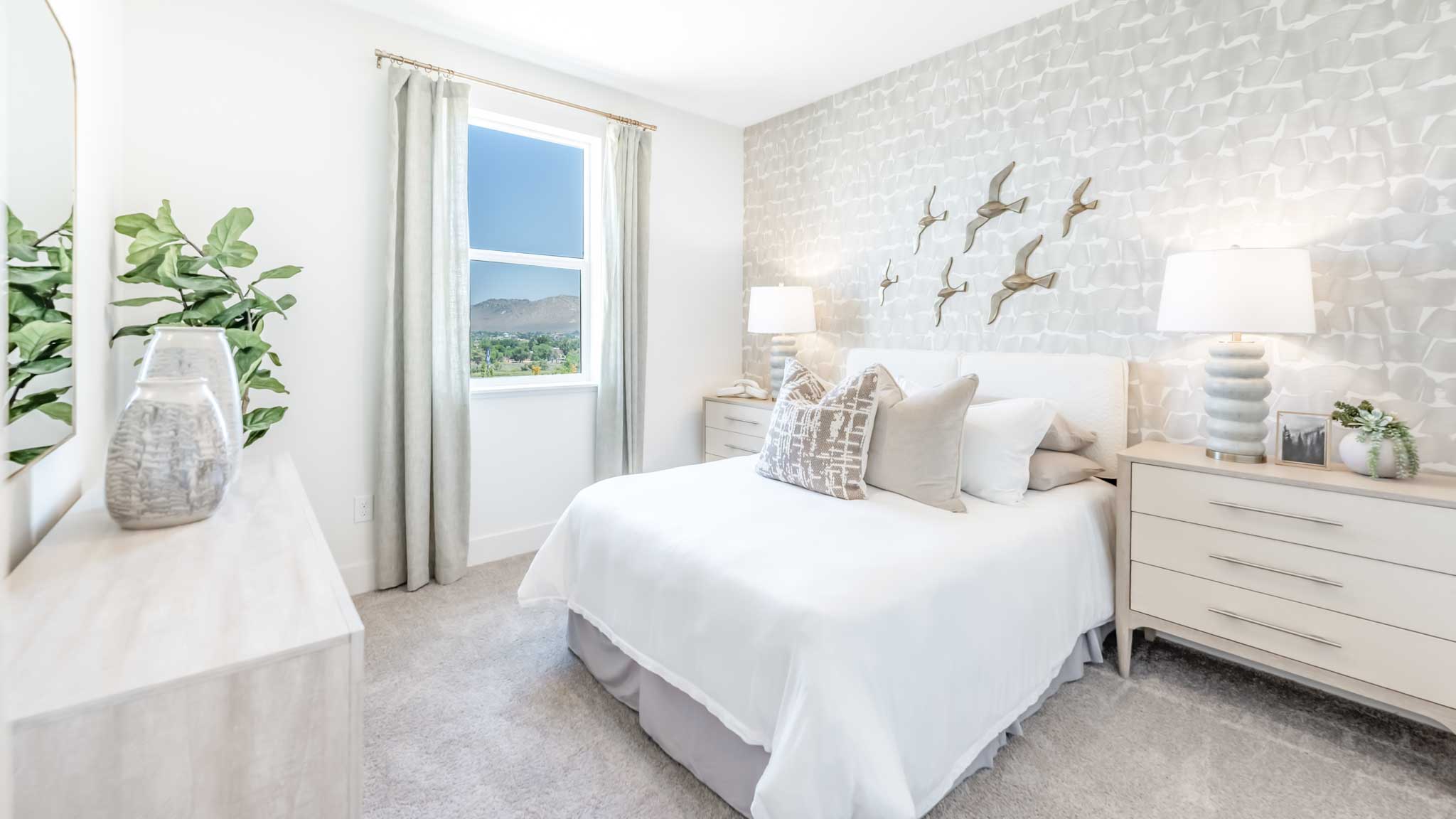 Elegant secondary bedroom with a window