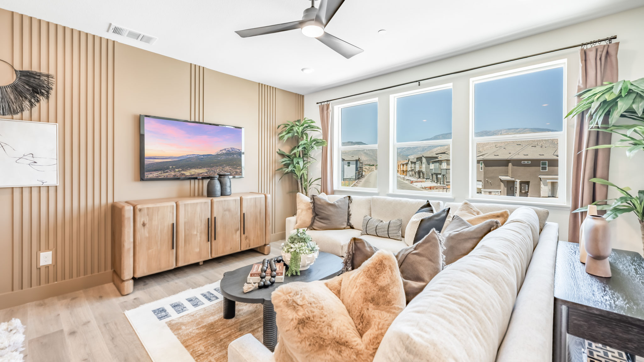 Bright open concept great room with large windows