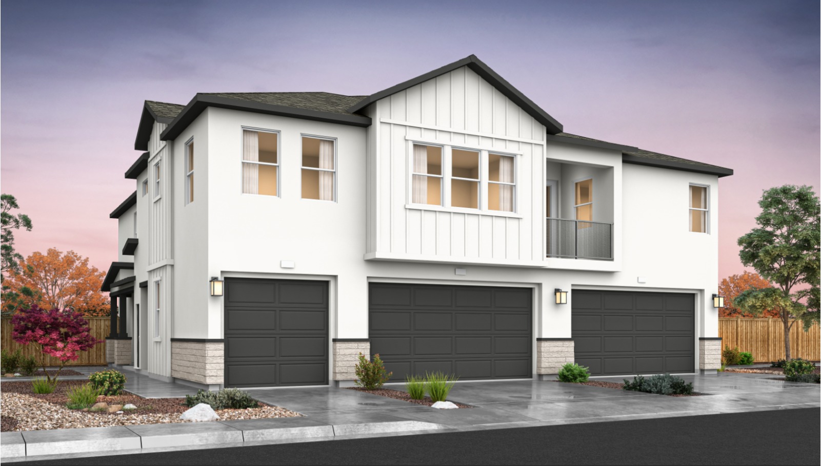 Rendered photo of the back of a three plex with garages