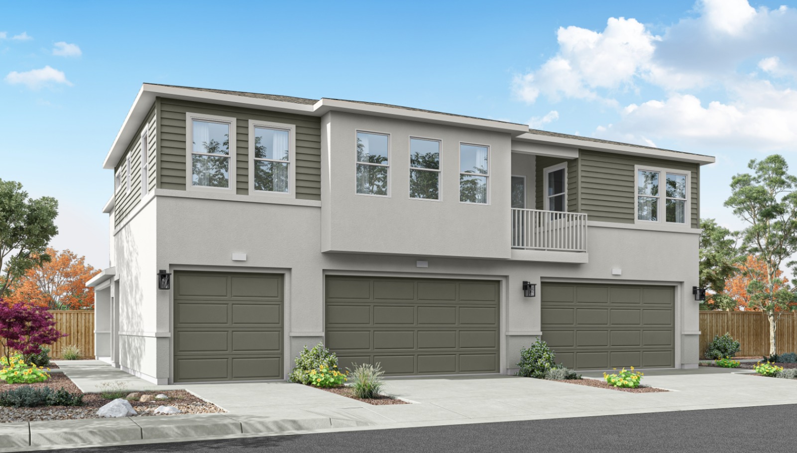 Rendered photo of the back of a three plex with garages