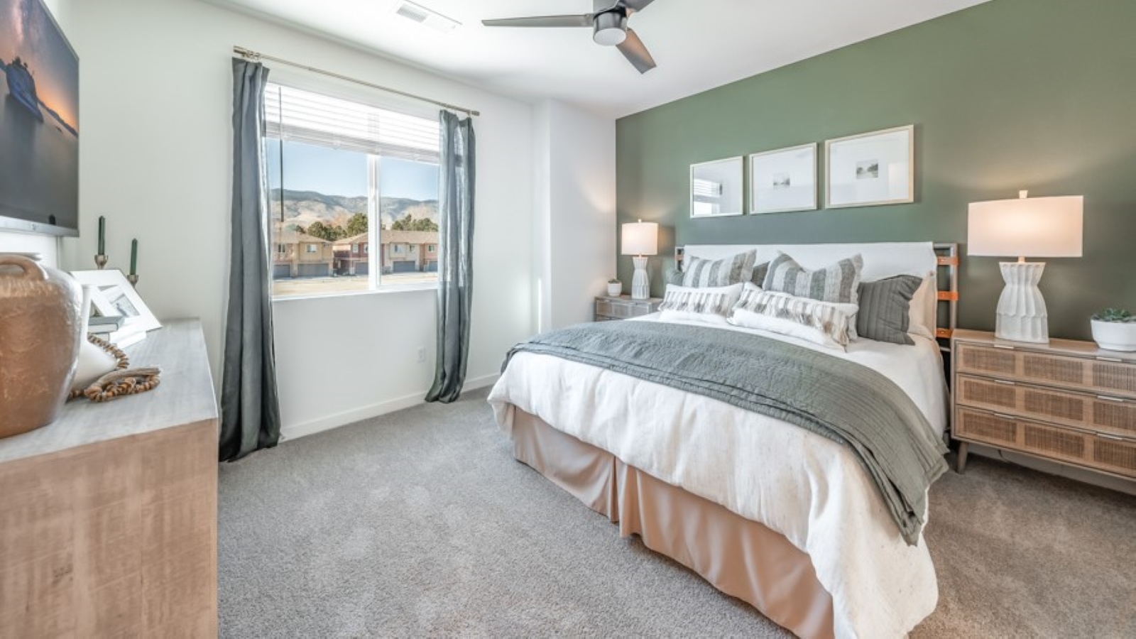 Primary bedroom with carpeted floor and attached bathroom