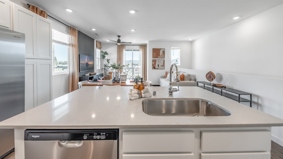 Modern kitchen looking out towards the great room