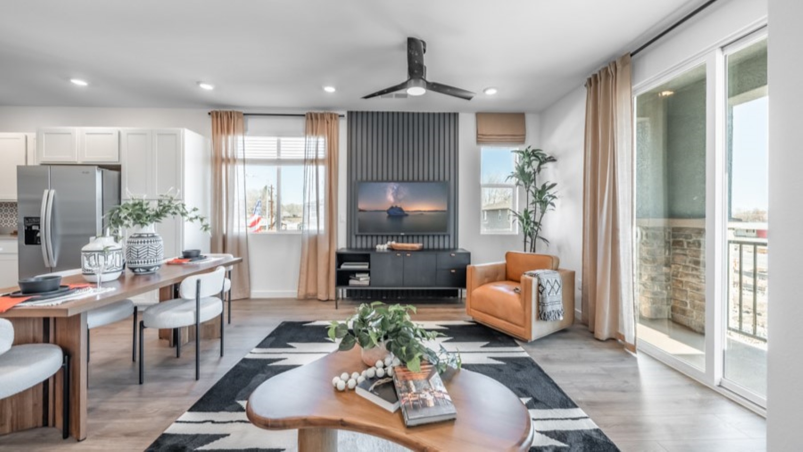 Open concept great room with deck