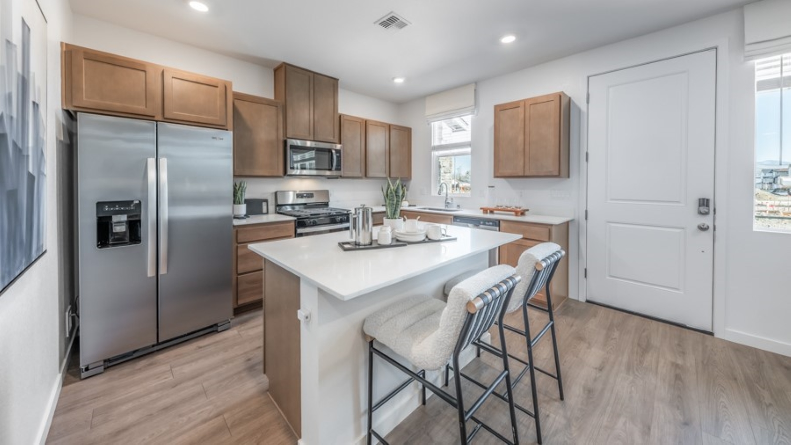 Kitchen with stainless steel appliances and island