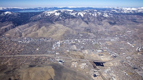 Aerial of Arbor Villas community with Lake Tahoe in the background