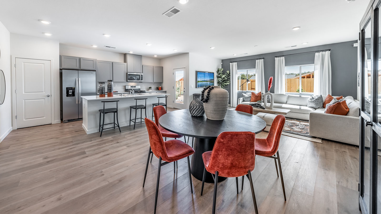 Dining area with room for a full-sized kitchen table looking out to kitchen and living room