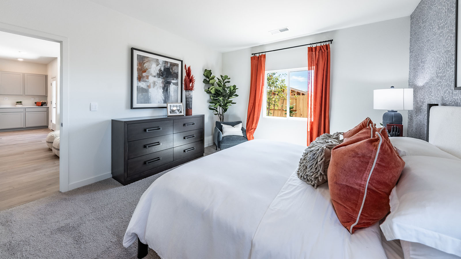 Carpeted primary bedroom with cozy design
