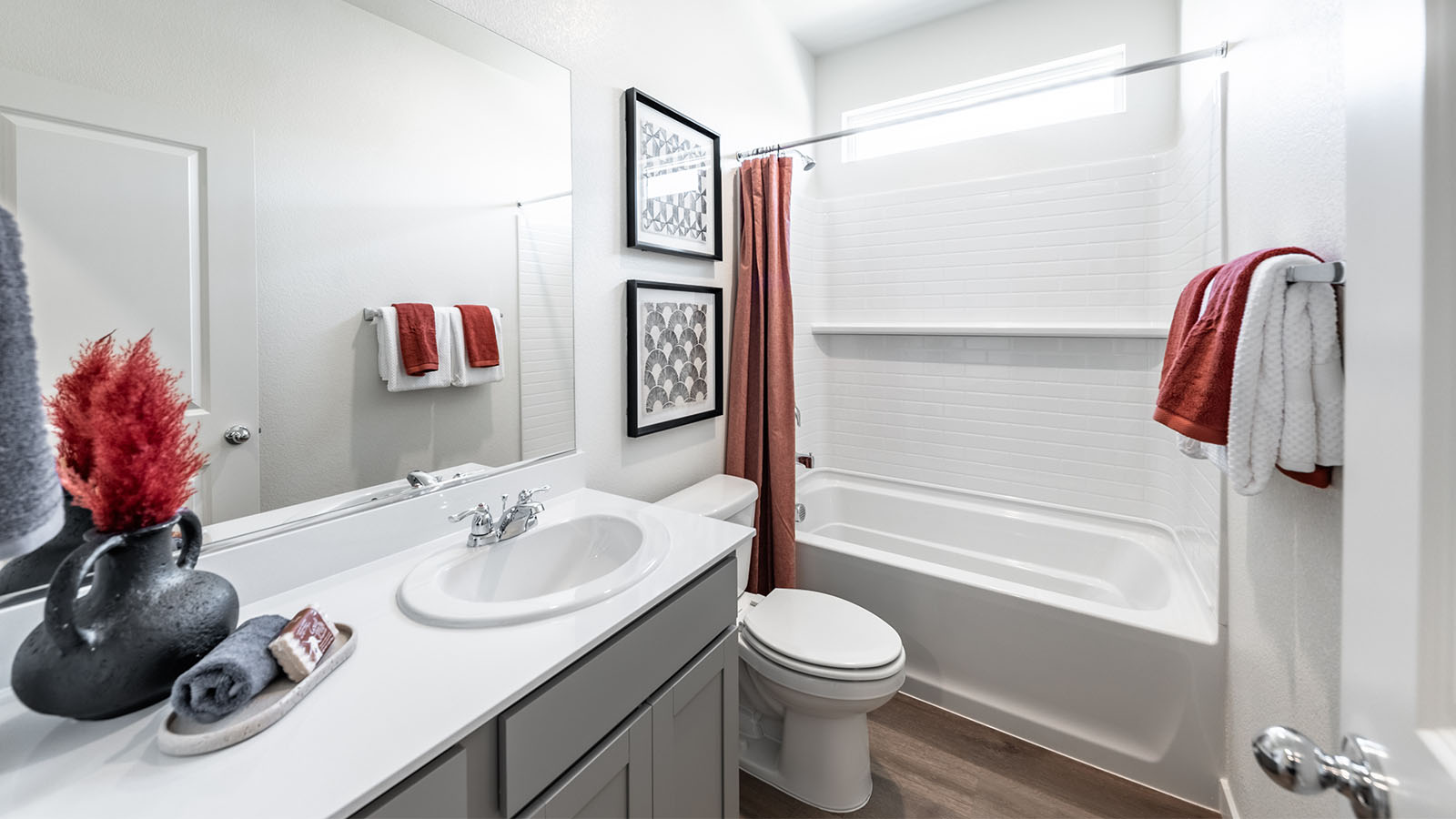 Secondary bathroom with bath tub and shower combo
