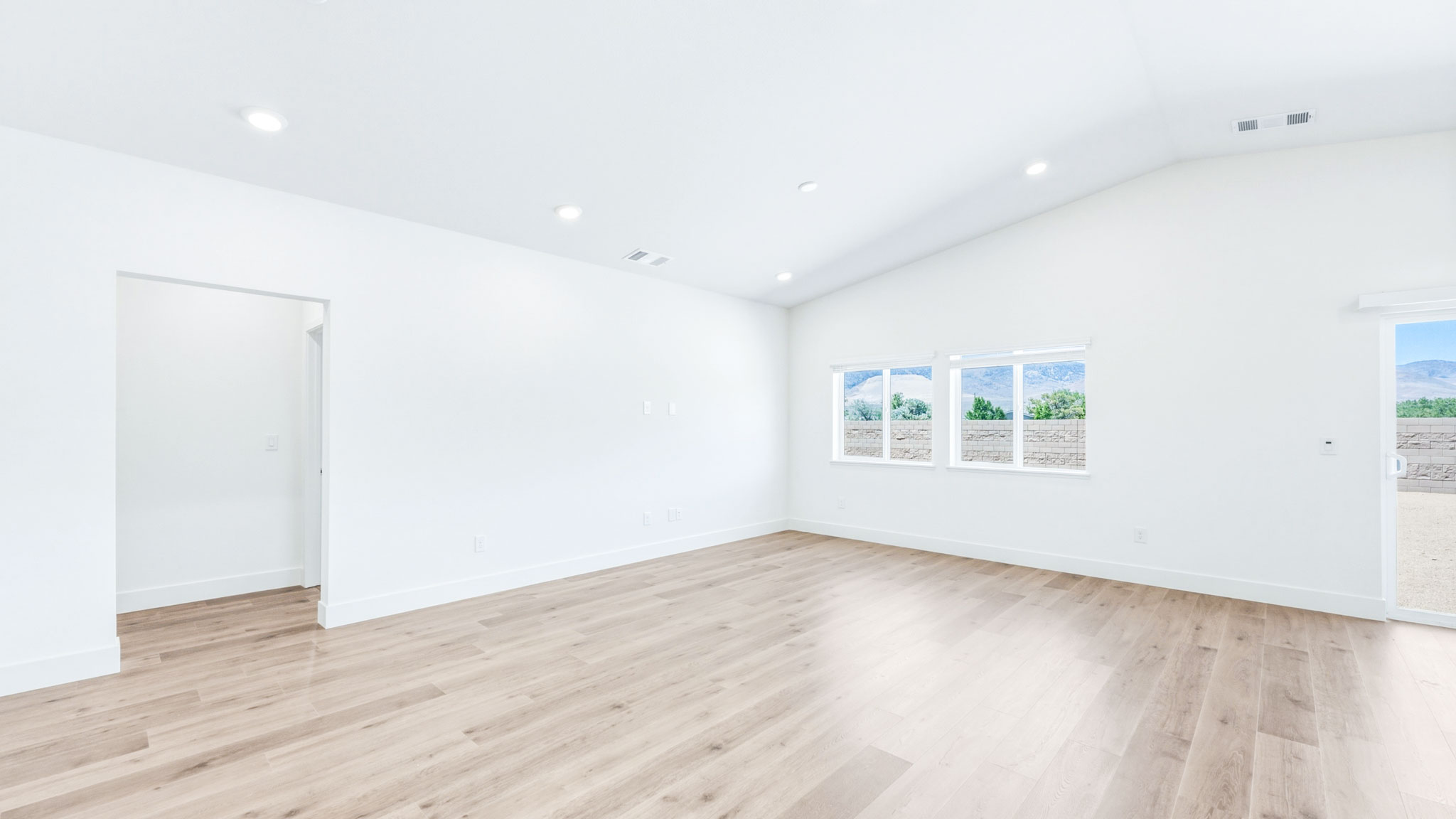 Open concept great room with plenty of windows for light