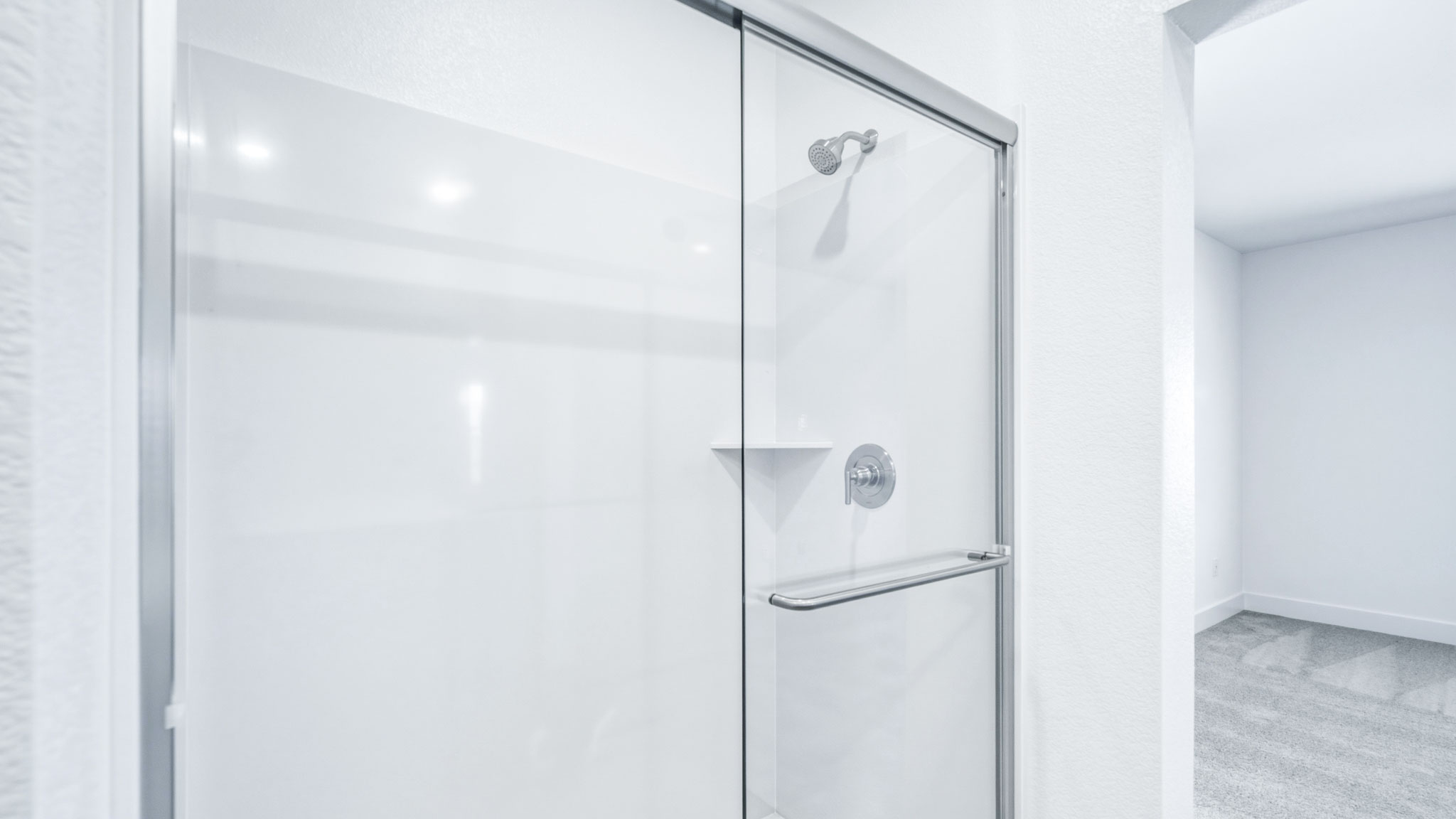 Large walk in shower with glass enclosure