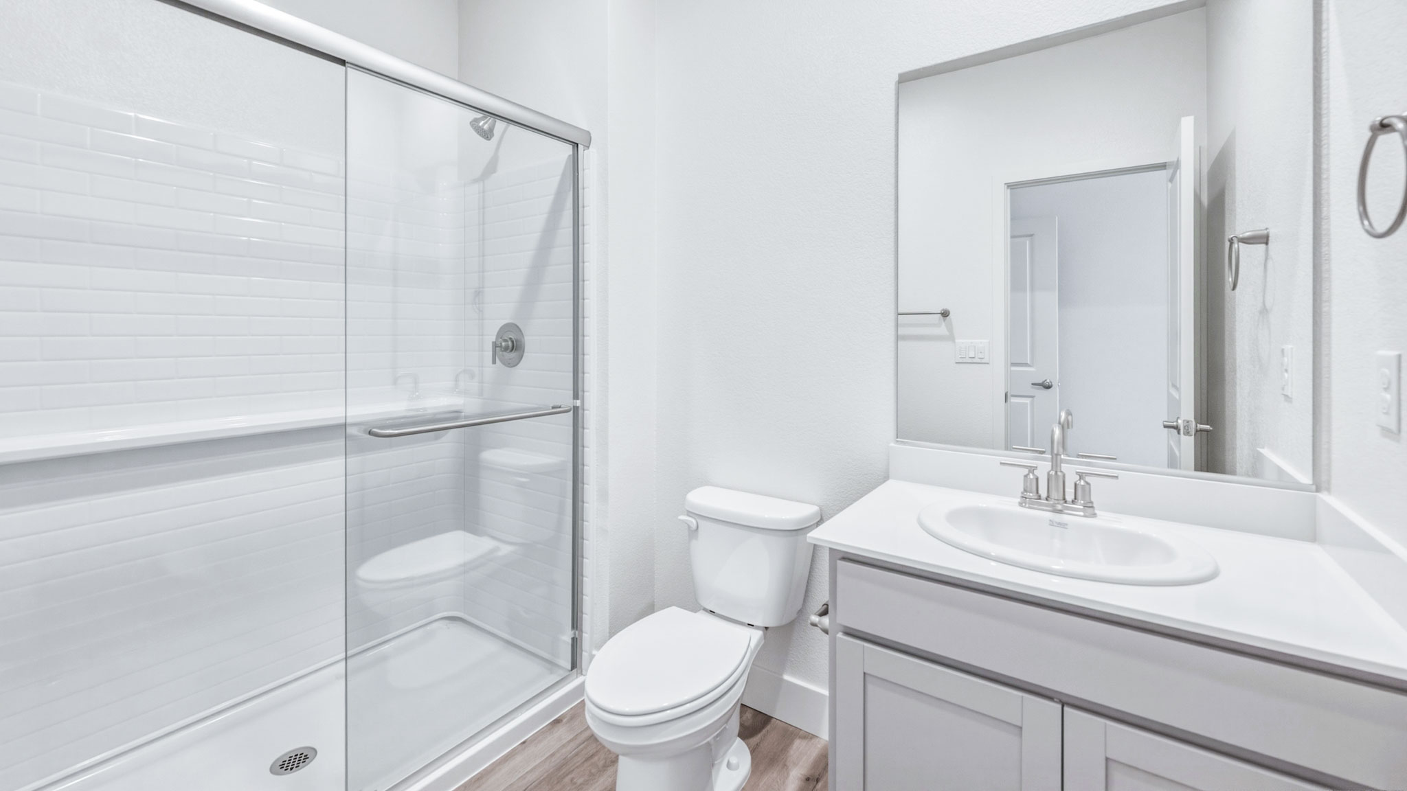 Secondary bathroom with toilet and stand alone shower