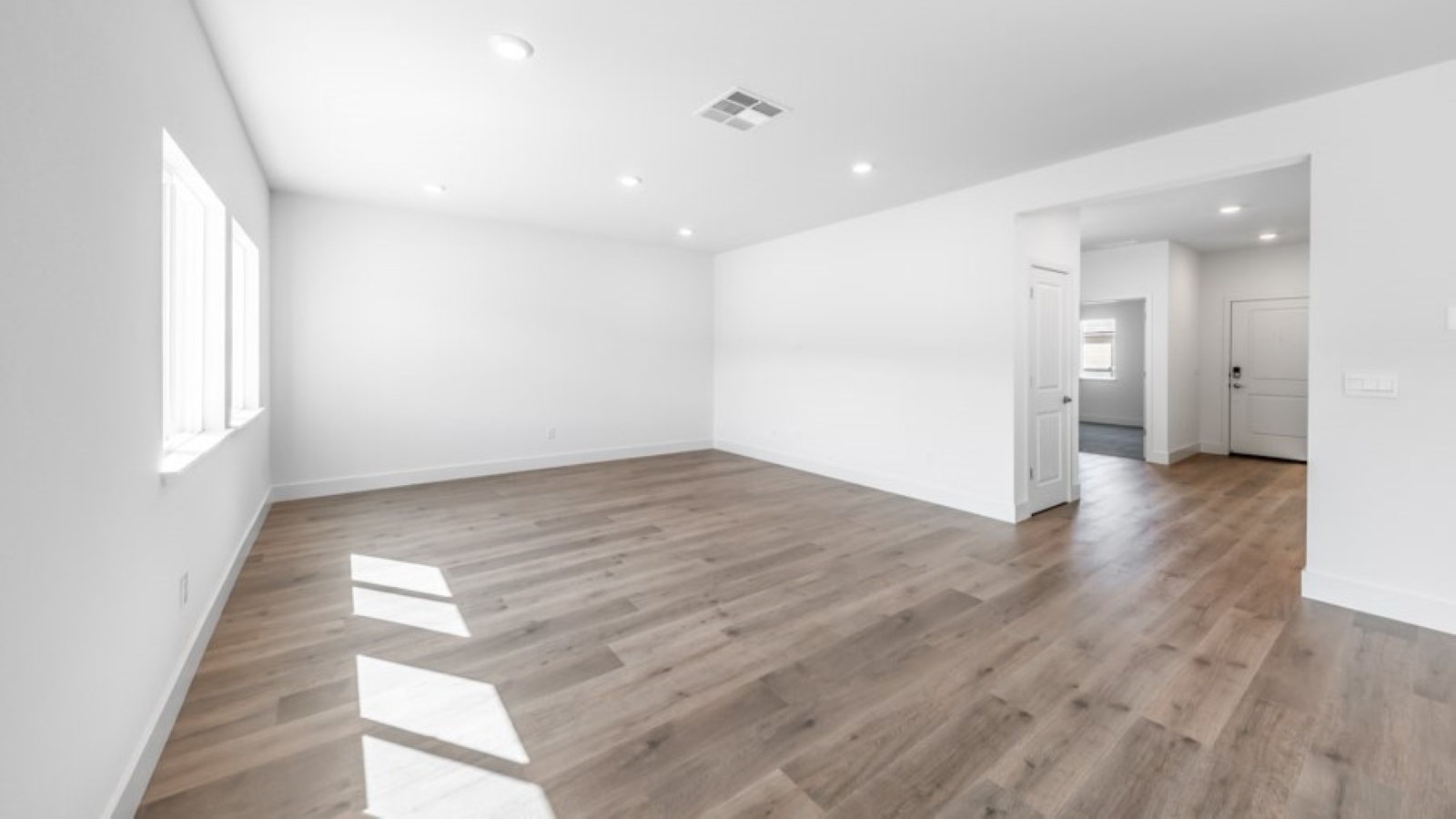 Open-concept first floor living room with bright natural light