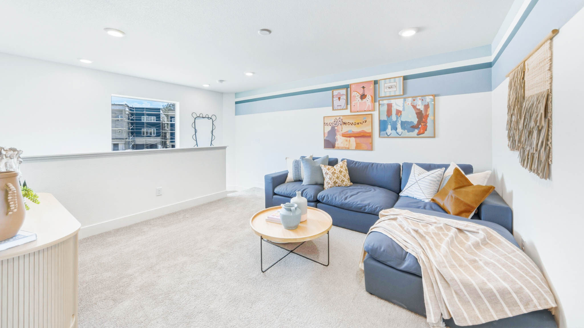 Upstairs loft decorated with a large sectional