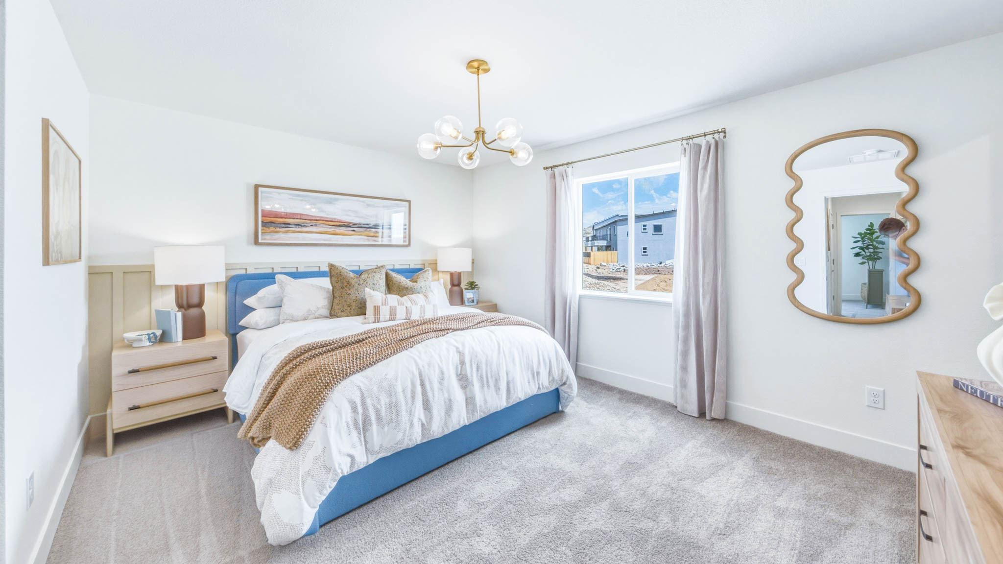 Bright primary bedroom with a large window