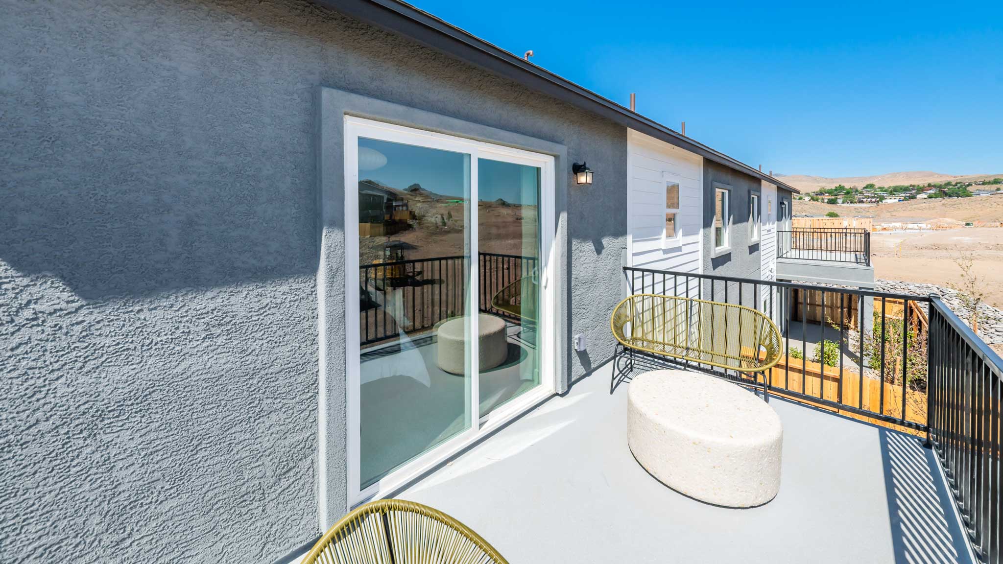 Deck off the primary bedroom looking towards the sliding door
