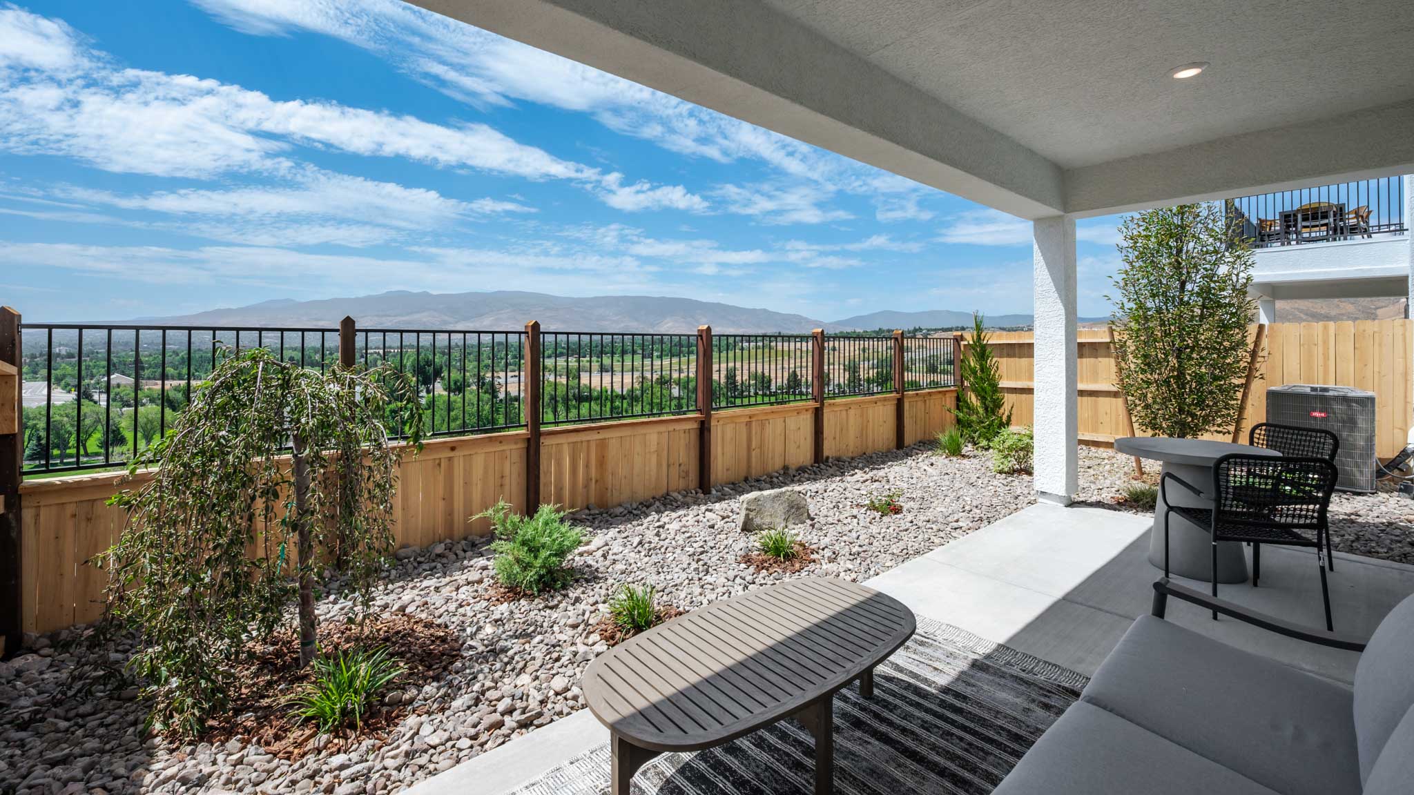 Covered backyard patio with outdoor furniture