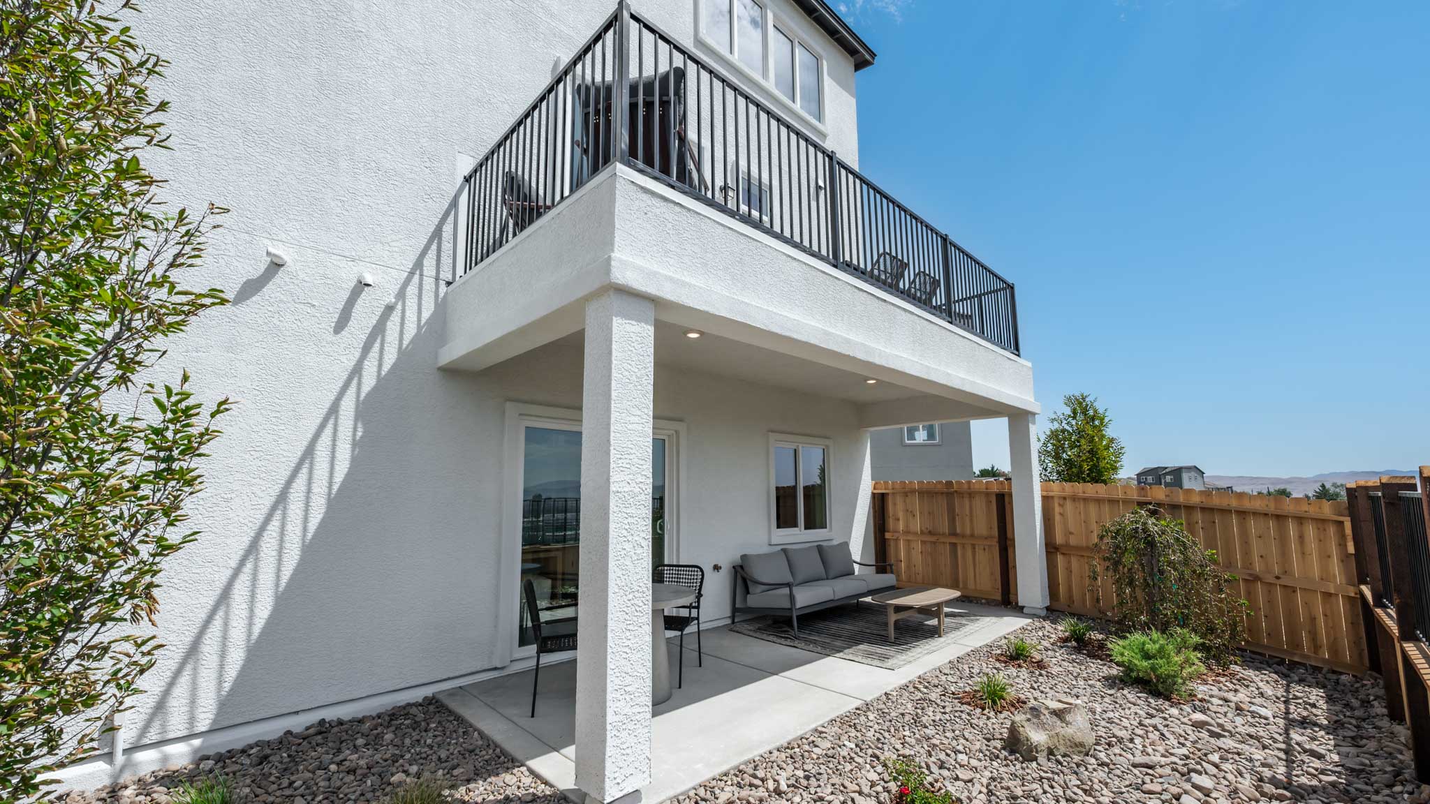 View of the patio and the deck from the backyard