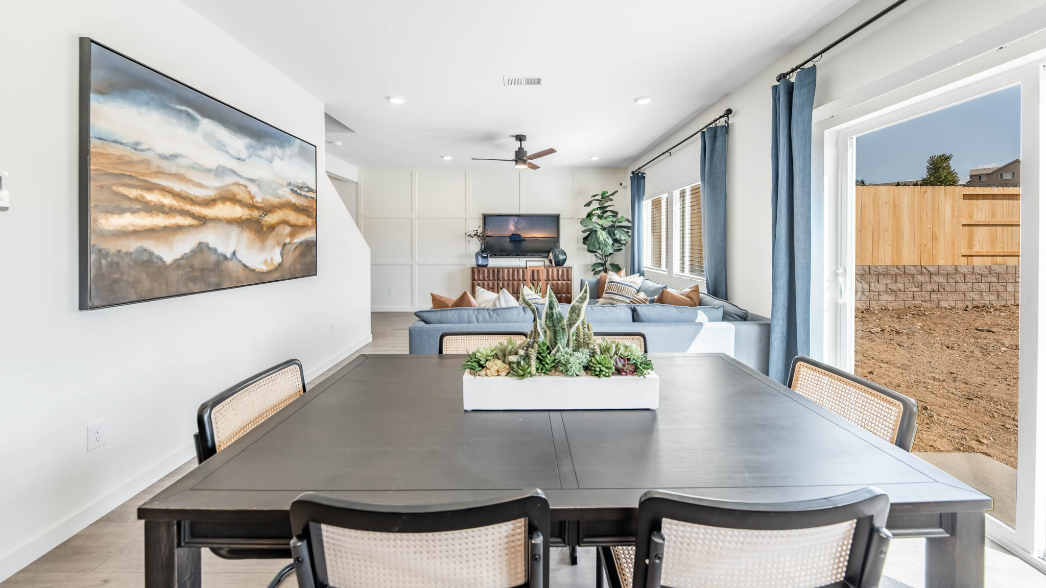 Dining room next to living room and backyard sliding door
