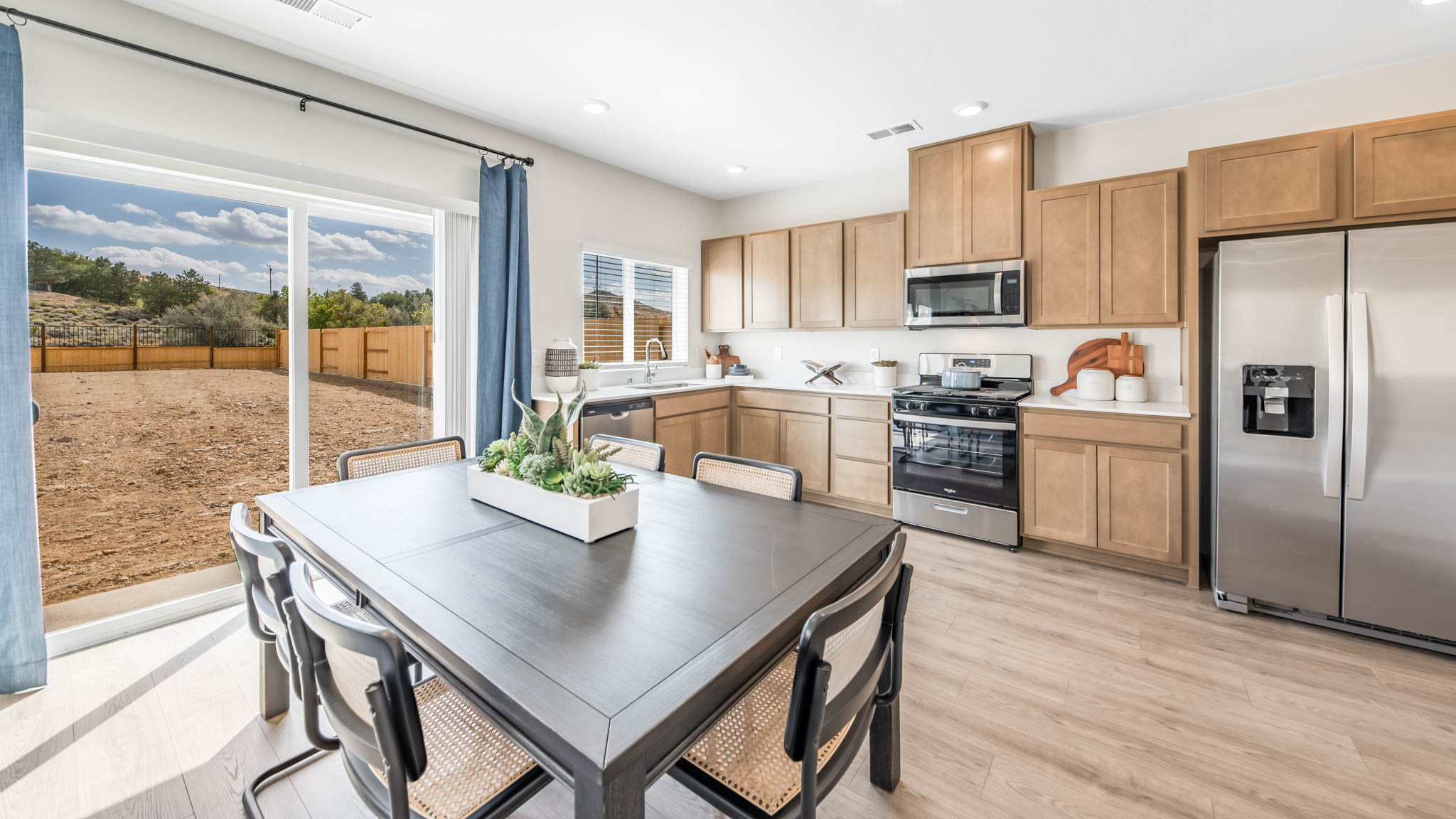 Dining room next to kitchen backyard sliding door