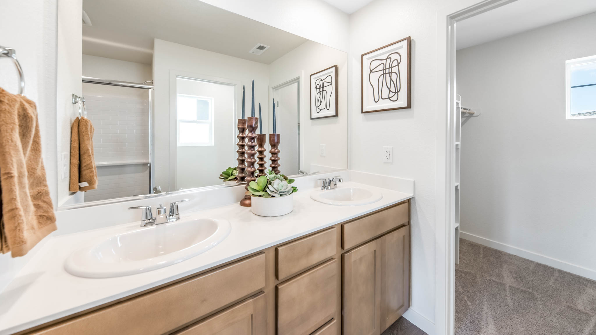 Dual vanity with a large mirror in the primary bathroom