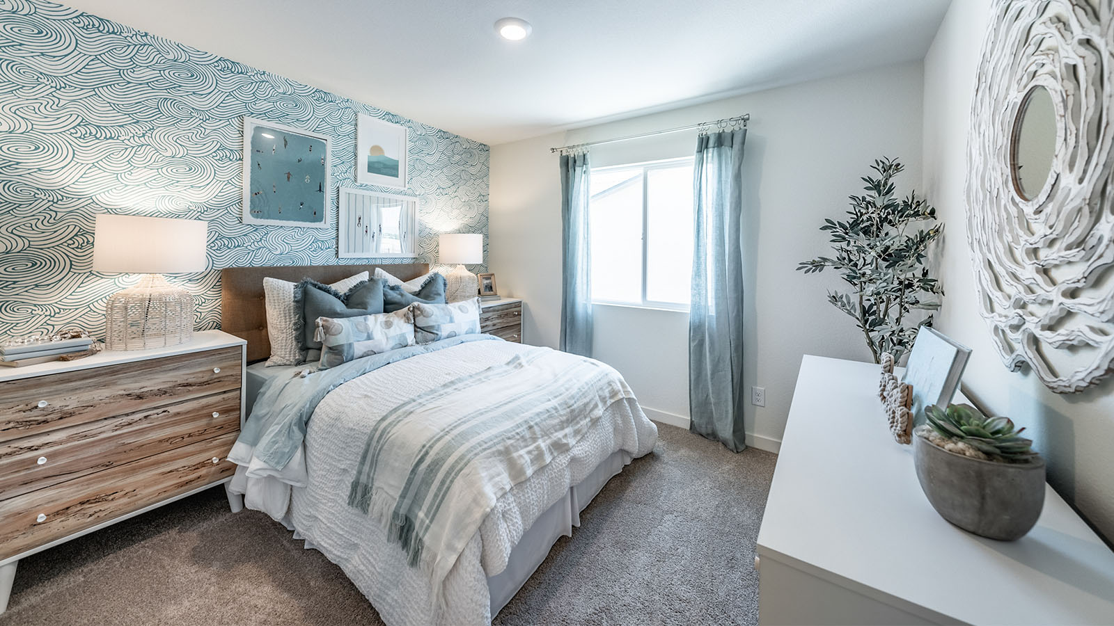 Bright secondary bedroom with carpeted floors and cozy design
