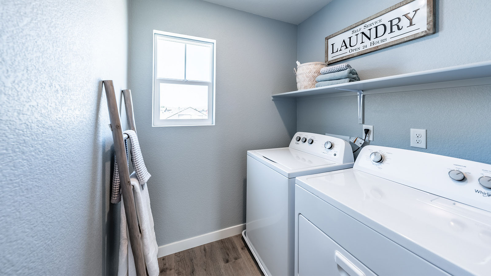 Laundry room with a small window and room for a washer and dryer