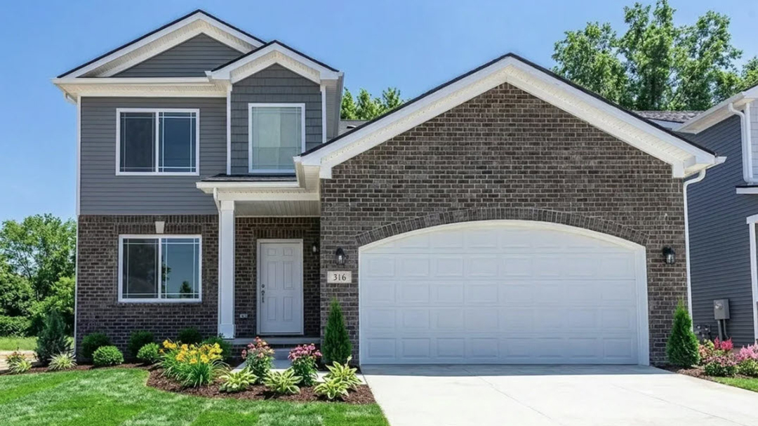 Brick two story home with accent lap siding and shake