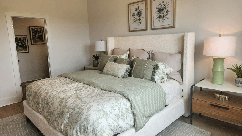 Primary bedroom with king size bed and nightstand