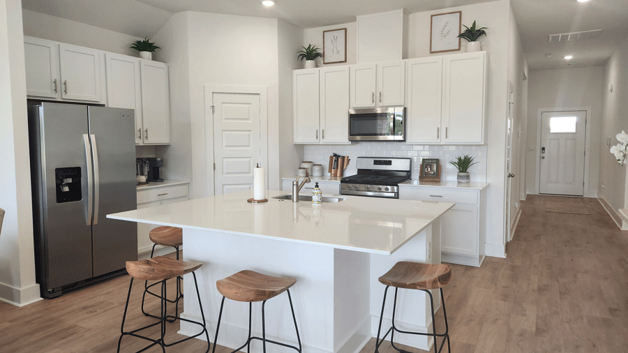Kitchen with island and white cabinets