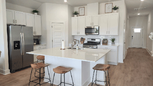 Kitchen with large island and white cabinets
