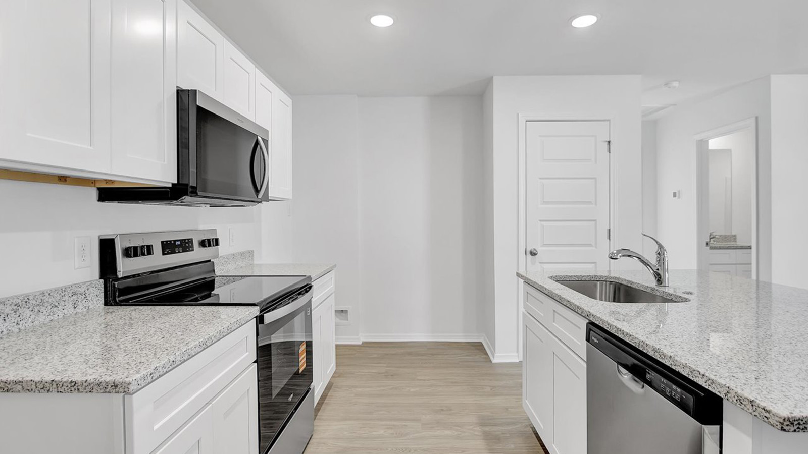 Kitchen with white cabinets and island