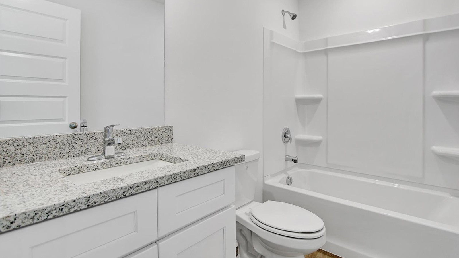 guest bathroom with vanity and bath shower combo