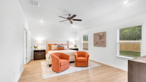 Large bedroom 1 with bed and two chairs