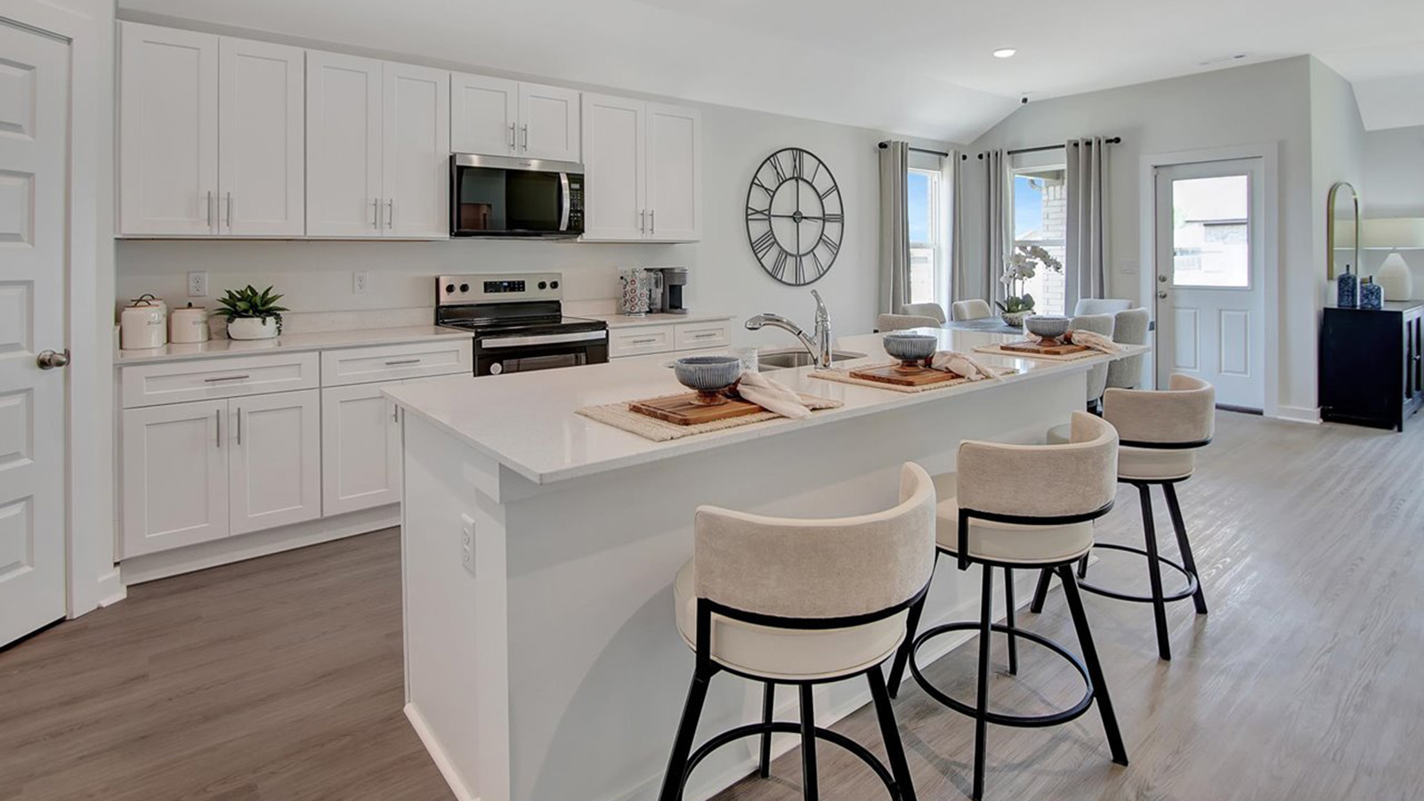 Kitchen with island and white cabinets