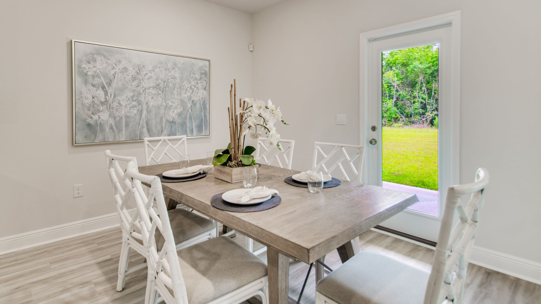 The Beau floorplan dining room with access to the covered back patio