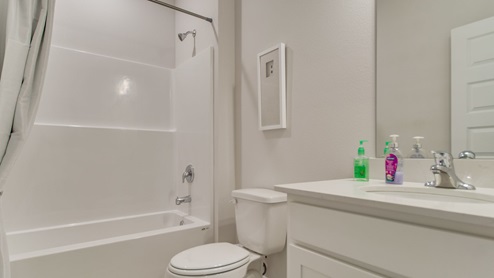 The Beau floorplan guest bathroom one with shower and tub combo