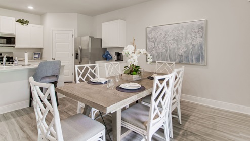 The Beau floorplan dining room with kitchen view