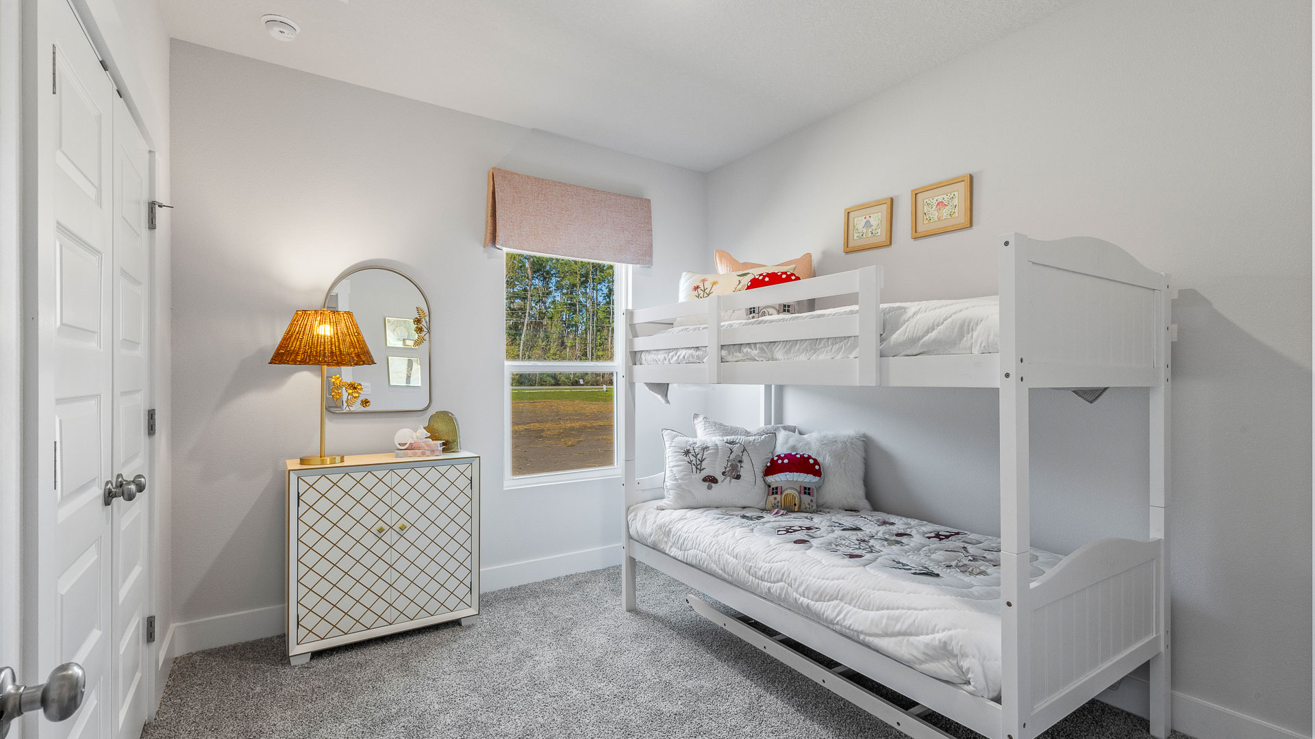 The Camilla Floorplan guest bedroom one with carpet throughout